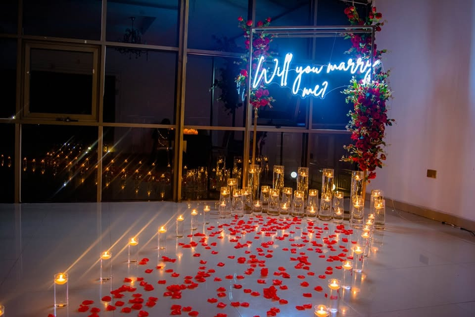 Romantic candle and rose-petal event setup