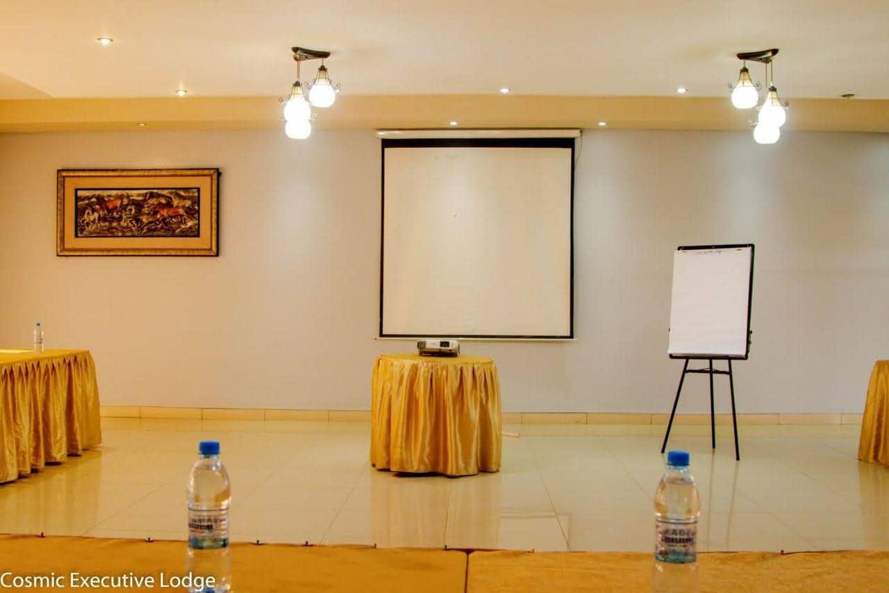 Conference presentation screen and flip chart at Cosmic Hotel